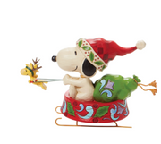 PEANUTS® by Jim Shore Enesco Santa Snoopy in Dog Bowl Sled